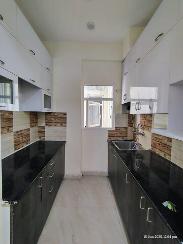 Kitchen in 2 BHK Apartment at Amrapali Enchante, Tech Zone 4 Greater Noida – for Rent