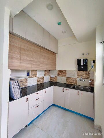 Kitchen in 2 BHK Apartment at Amrapali Enchante, Tech Zone 4 Greater Noida – for Rent