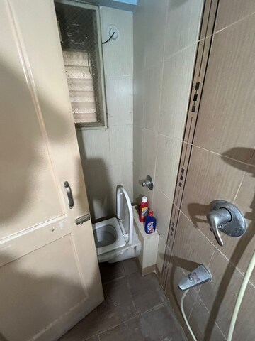 Bathroom in 2 BHK Apartment at Puranik City, Kasarvadavali – for Rent