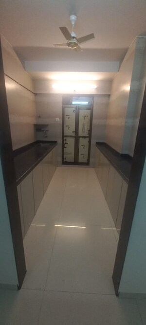 Kitchen in 2 BHK Apartment at Asmita Sand Dunes, Malad West – for Sale