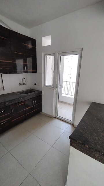 Kitchen in 3 BHK Apartment at Ajnara Daffodil, Sector 137 – for Rent