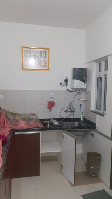 Kitchen in 2 BHK Apartment at Gera World of Joy, Kharadi – for Rent