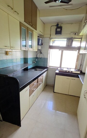 Kitchen in 2 BHK Apartment at Neelkanth Greens, Manpada – for Rent