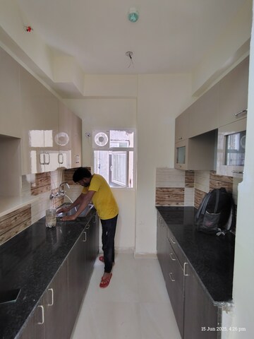 Kitchen in 2 BHK Apartment at Amrapali Enchante, Tech Zone 4 Greater Noida – for Rent