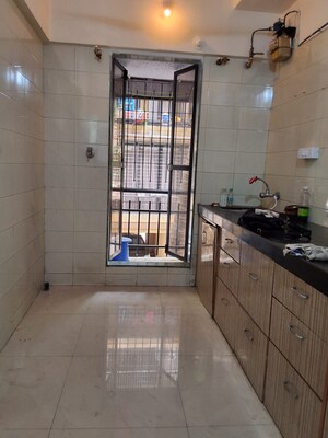 Kitchen in 2 BHK Apartment at Shree Darshan, Azad Nagar – for Sale