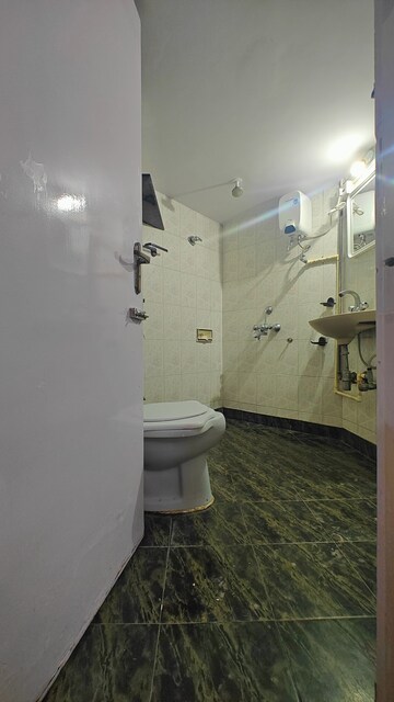 Bathroom in 2 BHK Apartment at Falcon Crest Apartments, Yogi Nagar – for Rent