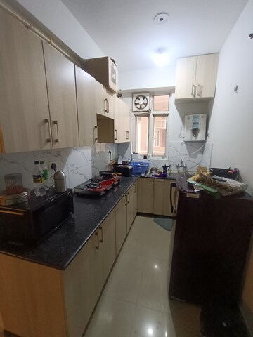 Kitchen in 1 RK Apartment at Aims Golf City, Sector 75 – for Rent
