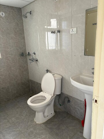 Bathroom in 3 BHK Apartment at Mahagun Mywoods, Sector 16c Greater Noida – for Rent