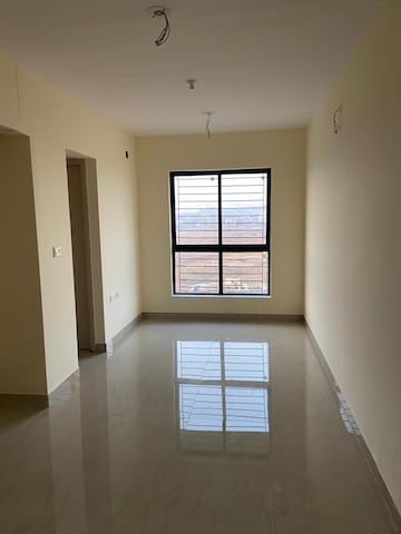 Living Room in 1 BHK Apartment at Lodha Palava Crown, Dombivli East – for Rent