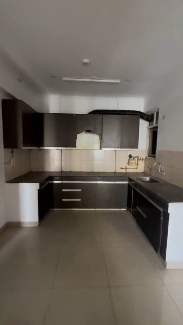 Kitchen in 2.5 BHK Apartment at Panchsheel Wellington, Dundahera – for Sale