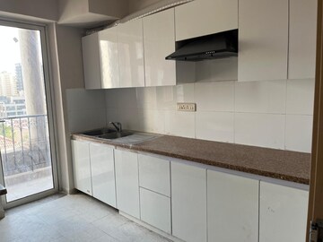 Kitchen in 2.5 BHK Apartment at Smart World Gems, Sector 89 – for Rent
