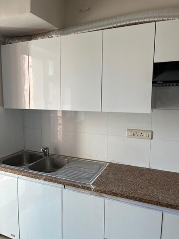 Kitchen in 2.5 BHK Apartment at Smart World Gems, Sector 89 – for Rent