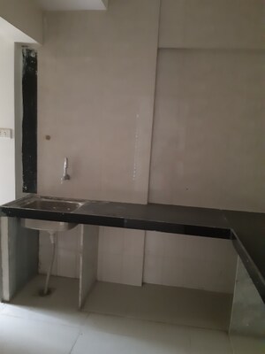 Kitchen in 3 BHK Apartment at Ojass Awantika CHS, Naupada – for Sale