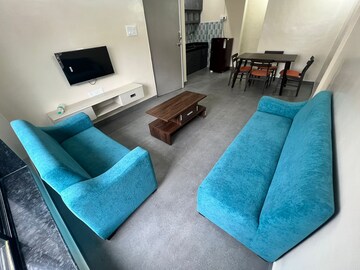 Living Room in 1 BHK Apartment at Skylon Tower, Boat Club Road – for Rent