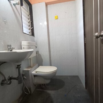 Bathroom in 2 BHK Apartment at Pushakraj CHS, Mulund East – for Rent