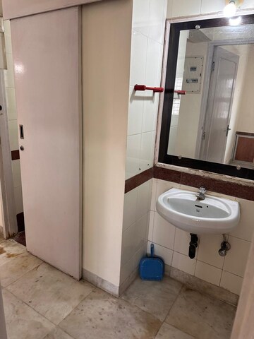 Bathroom in 1 BHK Apartment at Kalpataru Shravasti, Malad West – for Rent