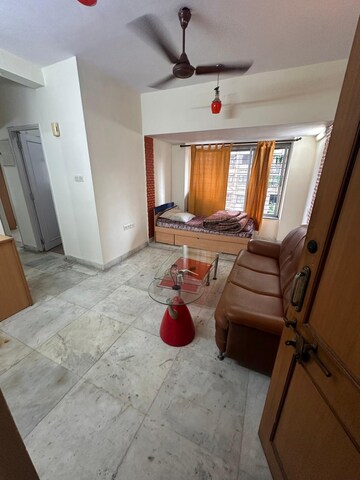 Living Room in 1 BHK Apartment at Kalpataru Shravasti, Malad West – for Rent