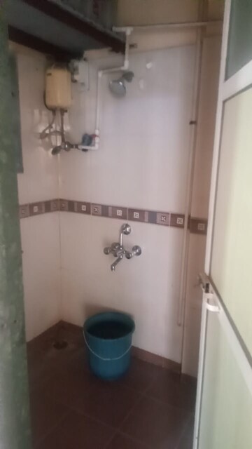 Bathroom in 1 BHK Apartment at Yashraj Park CHS, Kasarvadavali – for Rent