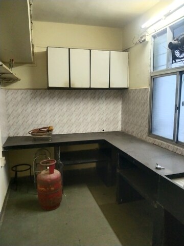 Kitchen in 1 BHK Apartment at Jagrut CHS, Gokhalenagar – for Rent