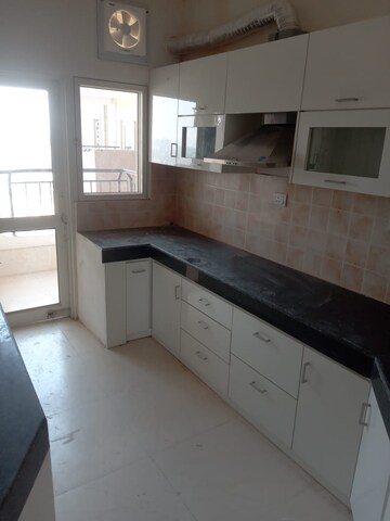 Kitchen in 3 BHK Apartment at Ramprastha Awho, Sector 95 – for Rent