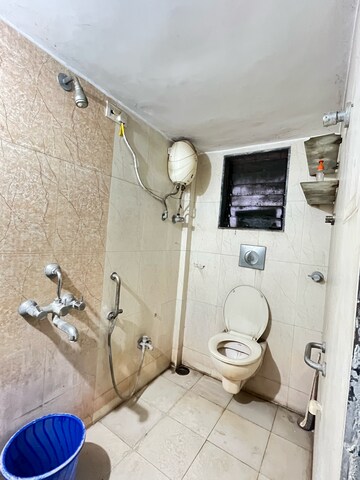 Bathroom in 1 BHK Apartment at Brahmand CHS, Brahmand – for Rent