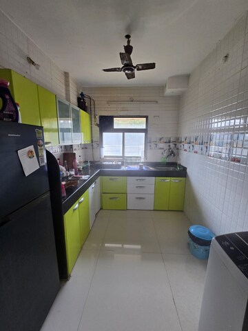 Kitchen in 2 BHK Apartment at Omkar Alta Monte, Malad East – for Sale