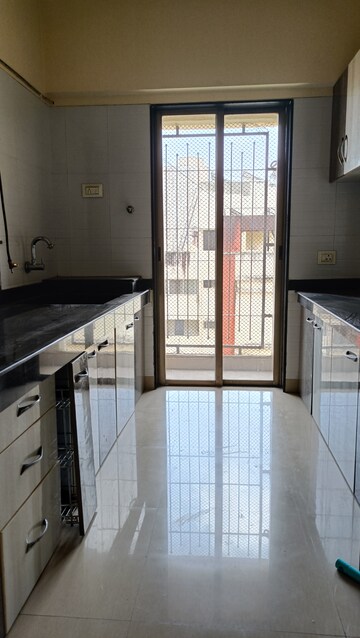 Kitchen in 1.5 BHK Apartment at Madhav Palacia, Ghodbunder Road – for Rent