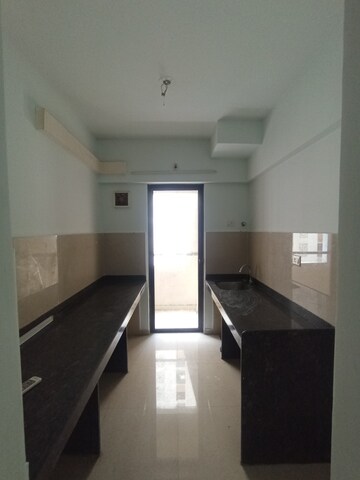 Kitchen in 1.5 BHK Apartment at Lodha Palava Downtown, Dombivli East – for Sale
