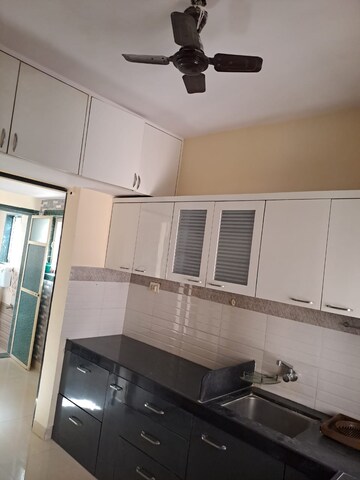 Kitchen in 2 BHK Apartment at Happy Valley, Manpada – for Rent