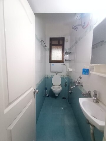 Bathroom in 2 BHK Apartment at Rupali CHS, Malad West – for Rent