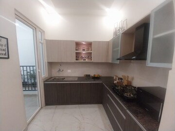 Kitchen in 4 BHK Apartment at Mahagun Mywoods, Sector 16c Greater Noida – for Rent