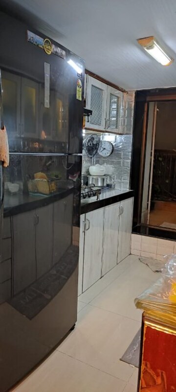 Kitchen in 3 BHK Apartment at Silver Arch Spring Co Operative Housing Society Ltd, Andheri West – for Sale