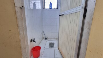 Bathroom in 1 BHK Apartment at Rishikesh CHS, Malad West – for Rent