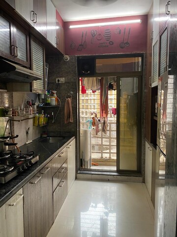 Kitchen in 2 BHK Apartment at Abhay Sheetal  Complex, Mira Road – for Sale