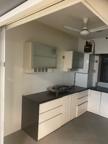 Kitchen in 3 BHK Apartment at Je And Vee Om Trimurti, Malad East – for Sale