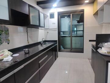 Kitchen in 3 BHK Apartment at Neelkanth Greens, Manpada – for Rent