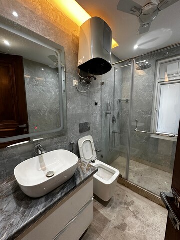 Bathroom in 3 BHK Apartment at Boutique Residential Apartments E-3 6, Vasant Vihar – for Rent