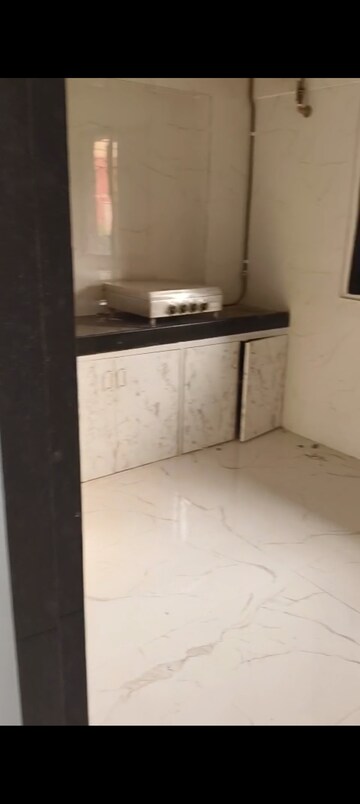 Kitchen in 1 BHK Apartment at Andheri CHS, Andheri West – for Rent