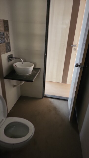 Bathroom in 2 BHK Apartment at Shree Tirupati STG Signature Residency, Patlipada – for Rent