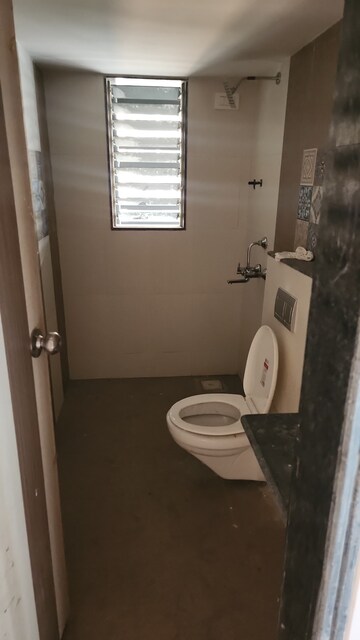 Bathroom in 2 BHK Apartment at Shree Tirupati STG Signature Residency, Patlipada – for Rent