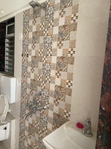 Bathroom in 1 BHK Apartment at Dharti Presidio, Malad West – for Rent