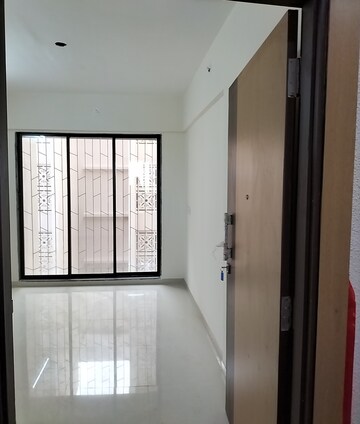 Building Lobby in 1 BHK Apartment at Ajmera Vishwa Nagri, Vasai East – for Rent