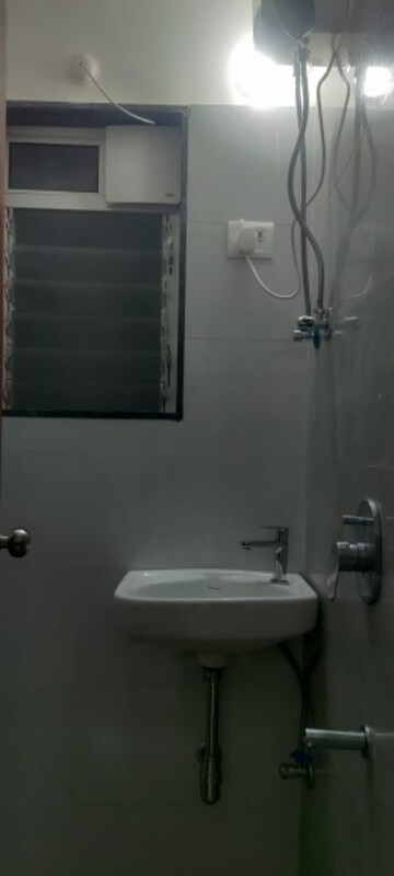 Bathroom in 1 BHK Apartment at Modi Spaces Valeram Palace, Malad West – for Rent