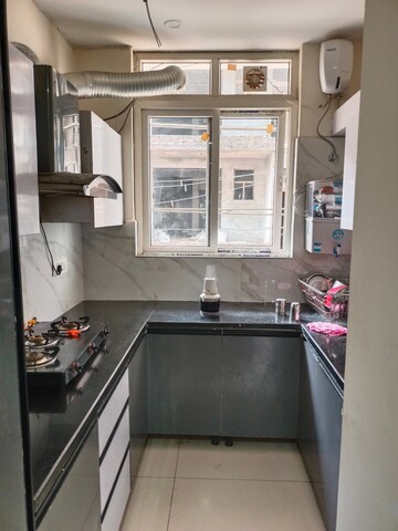 Kitchen in 3 BHK Builder Floor at Motia Blue Ridge, Dhakoli – for Sale