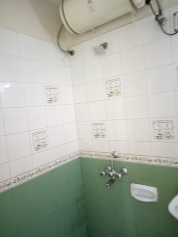 Bathroom in 3 BHK Apartment at Kusum Kunj, Prabhat Road – for Rent
