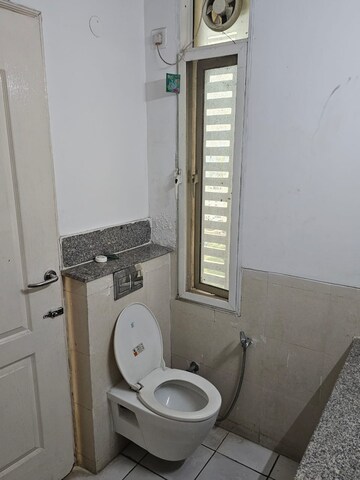 Bathroom in 2 BHK Apartment at Aims Golf City, Sector 75 – for Sale
