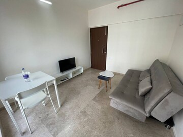 Living Room in 1 BHK Apartment at Omkar Signet, Malad East – for Rent