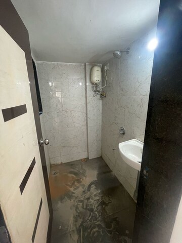 Bathroom in 1 BHK Apartment at RNA NG Canary, Mira Road – for Sale