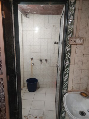 Bathroom in 2 BHK Apartment at Mira Sadan CHS, Mira Road – for Sale