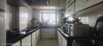 Kitchen in 2 BHK Apartment at RNA Hills, Andheri East – for Sale